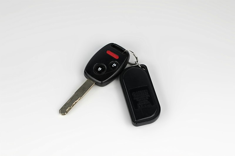 A car key with a remote control attached to it