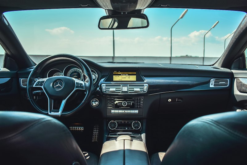 Black Mercedes-Benz vehicle steering wheel